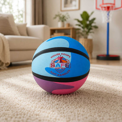 HouseHoops basketball - SH with Safe Sport Gear branding on a carpeted floor in a living room.